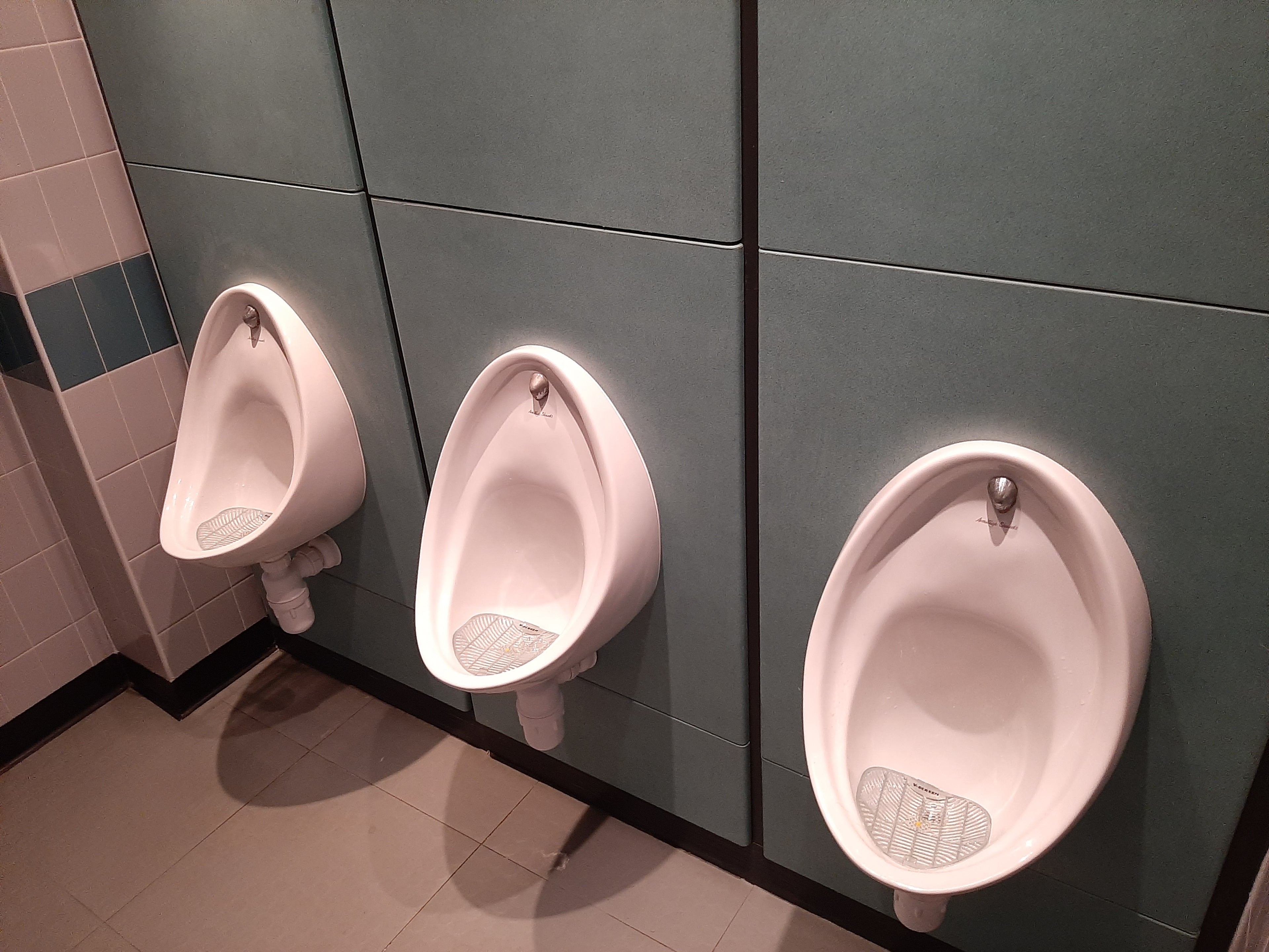 Urinal deep clean: three urinals after a professional clean