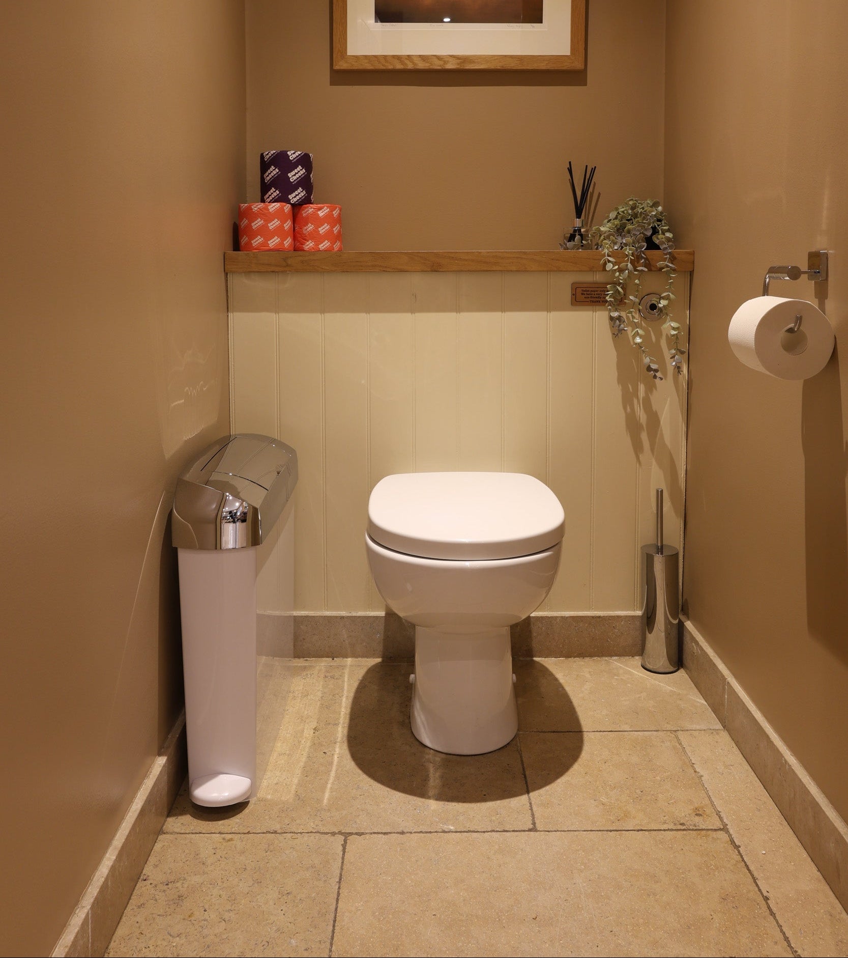 Hygiene waste disposal: sanitary bin in white and chrome in a clean WC
