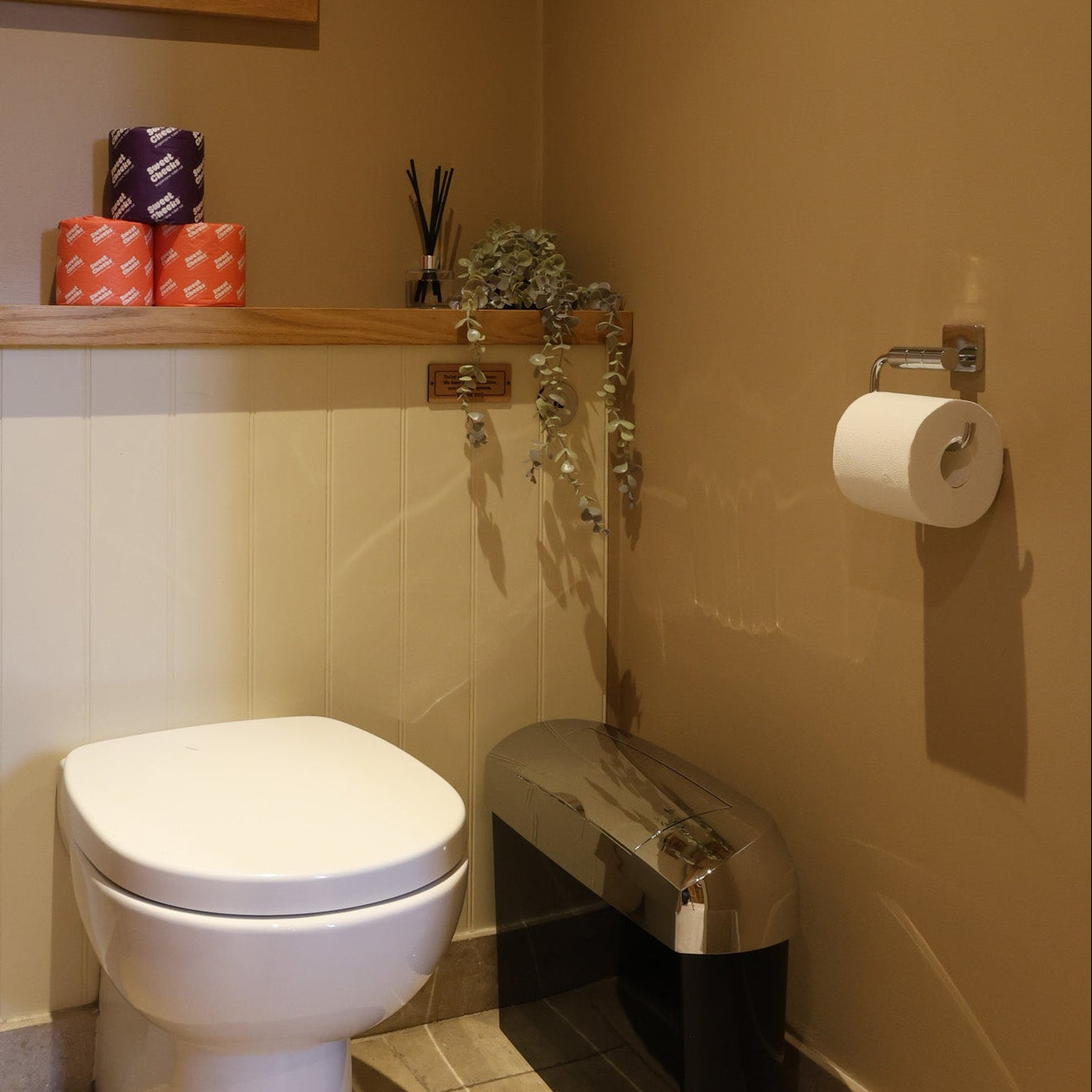 Sugarcane toilet roll on a wall mounted holder in a washroom