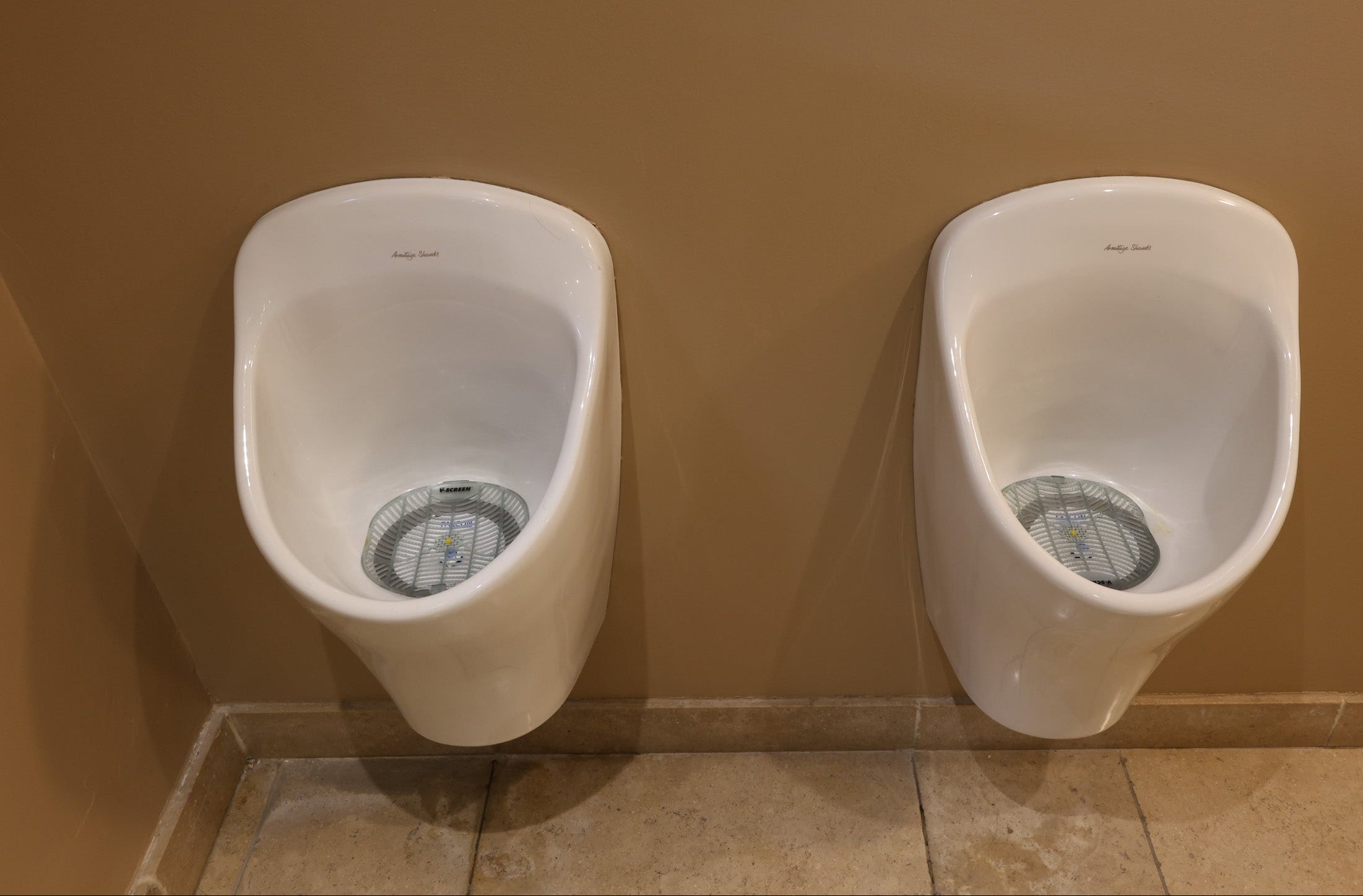 Urinal deep clean: two urinals restored in a men's washroom