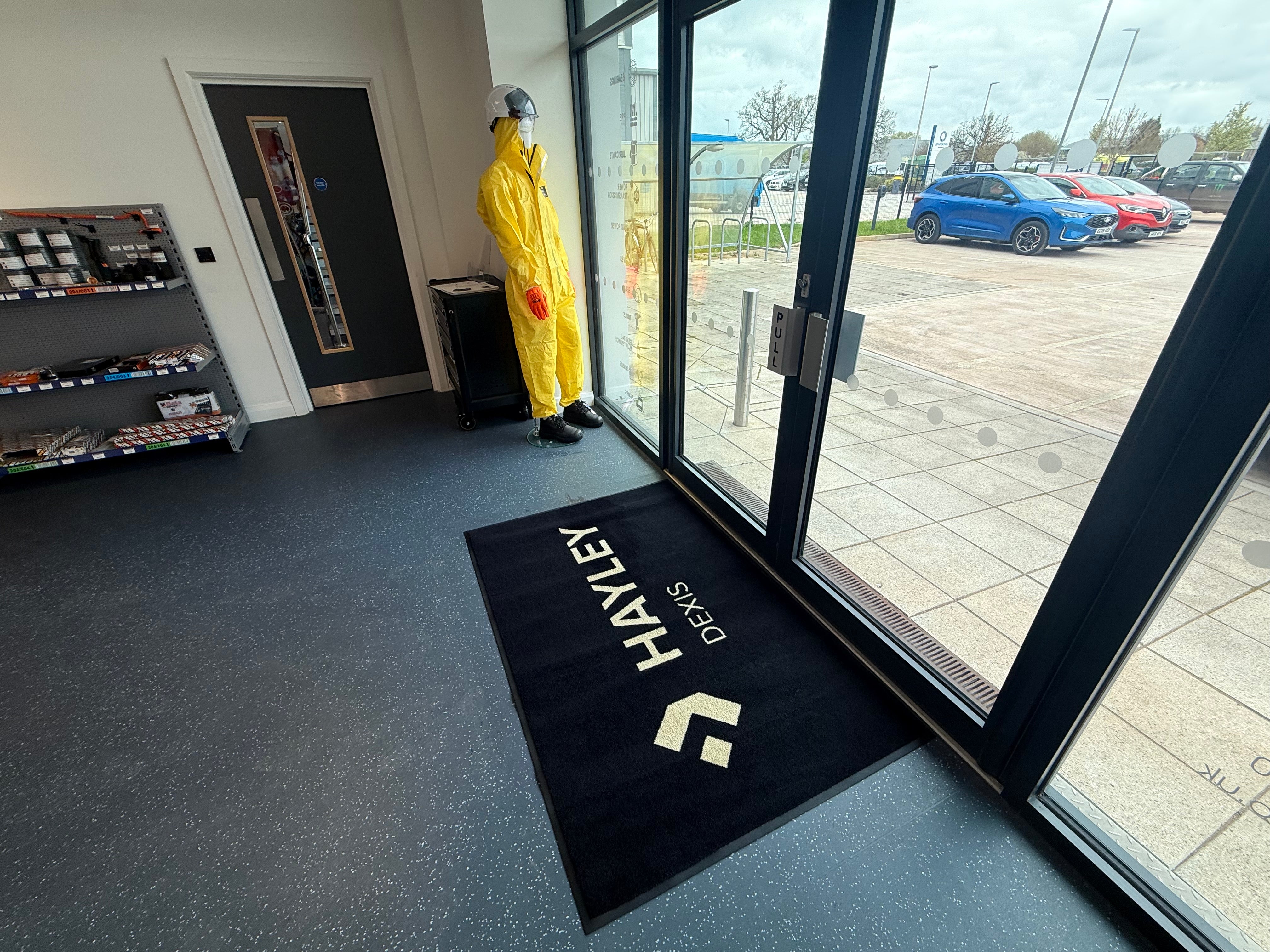 Mat services: branded logo mat at a building entrance