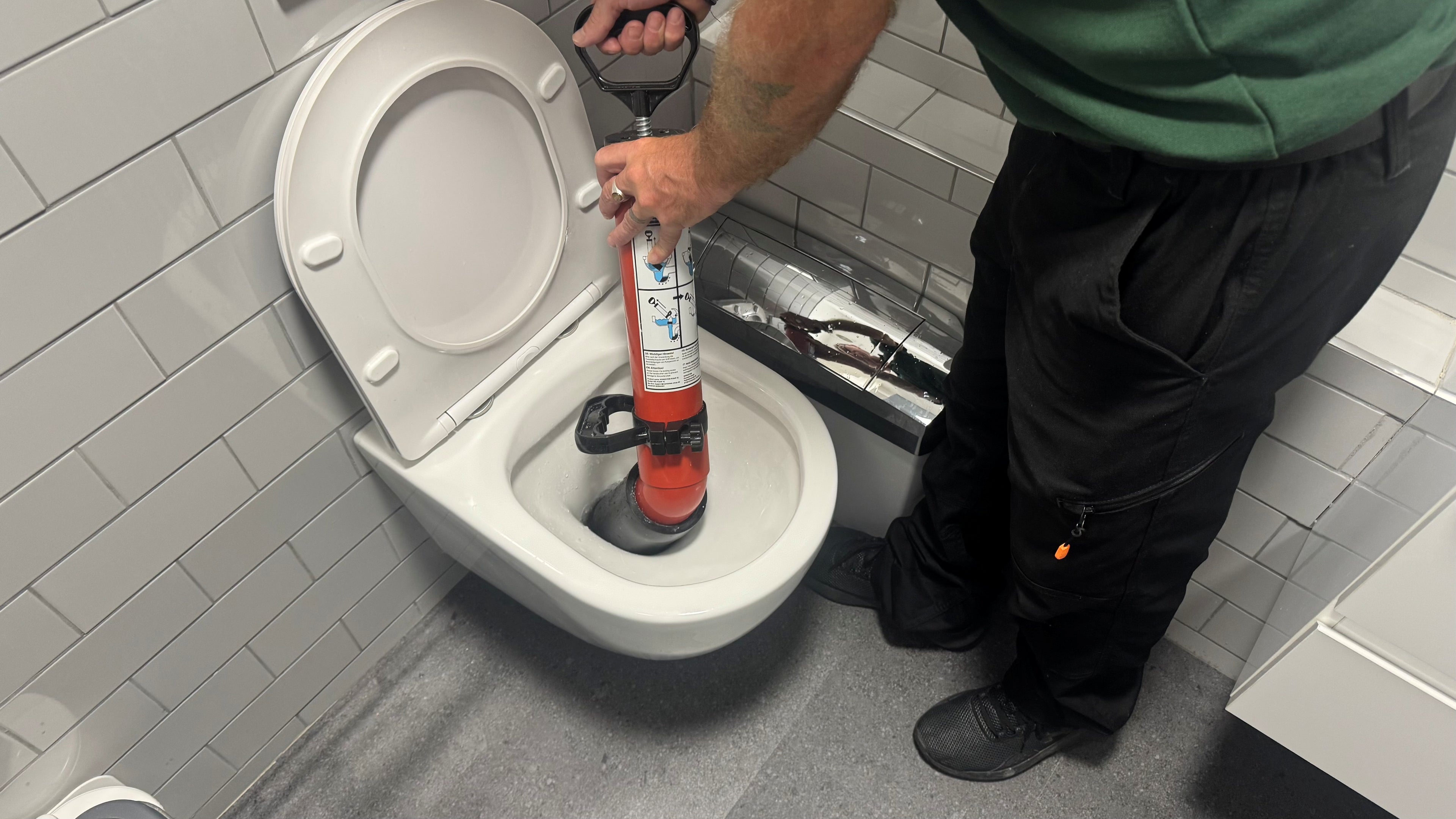 WC deep clean: an engineer cleaning a toilet