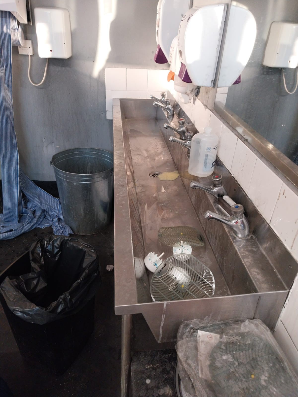 Sink before a deep clean, showing limescale build-up