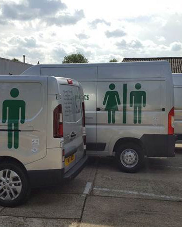 Waste Carriers Licence: three Greenworks Washrooms vans in a row