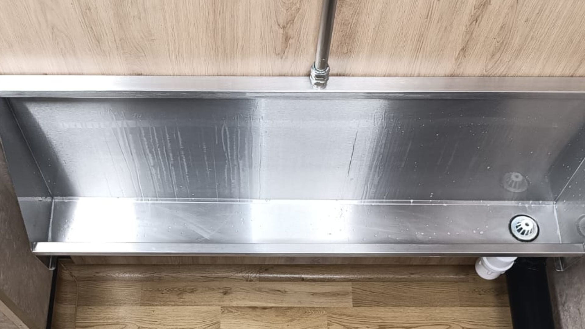 Trough after a deep clean, restored to a clean finish