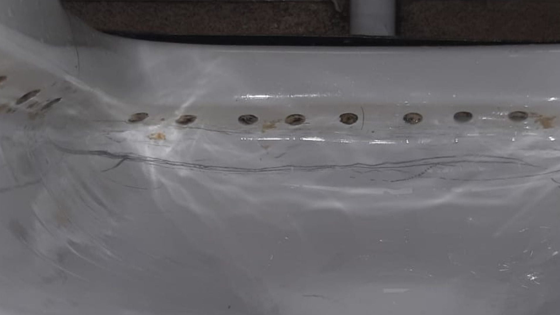 Toilet after a deep clean, showing a clean finish