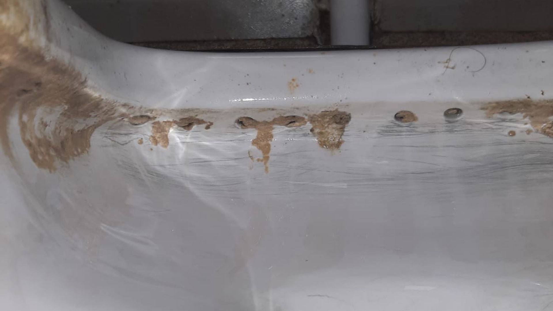 Toilet before a deep clean, showing staining