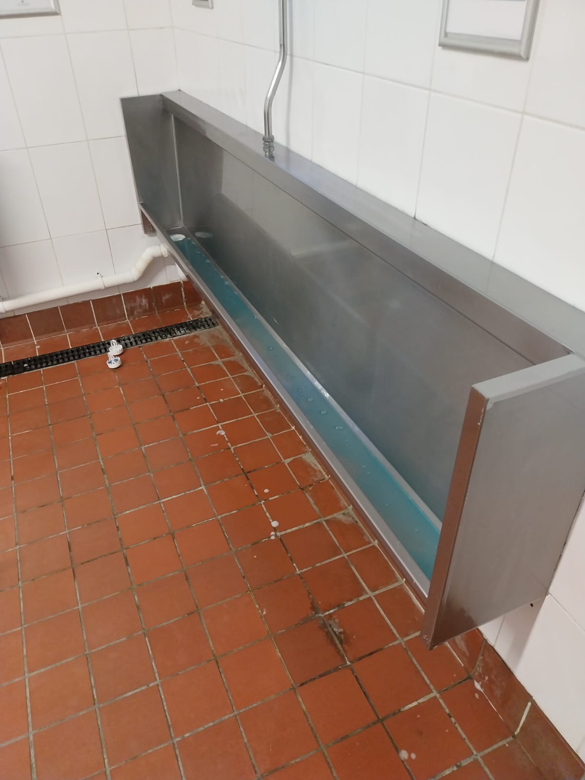 Trough after a deep clean in a commercial washroom