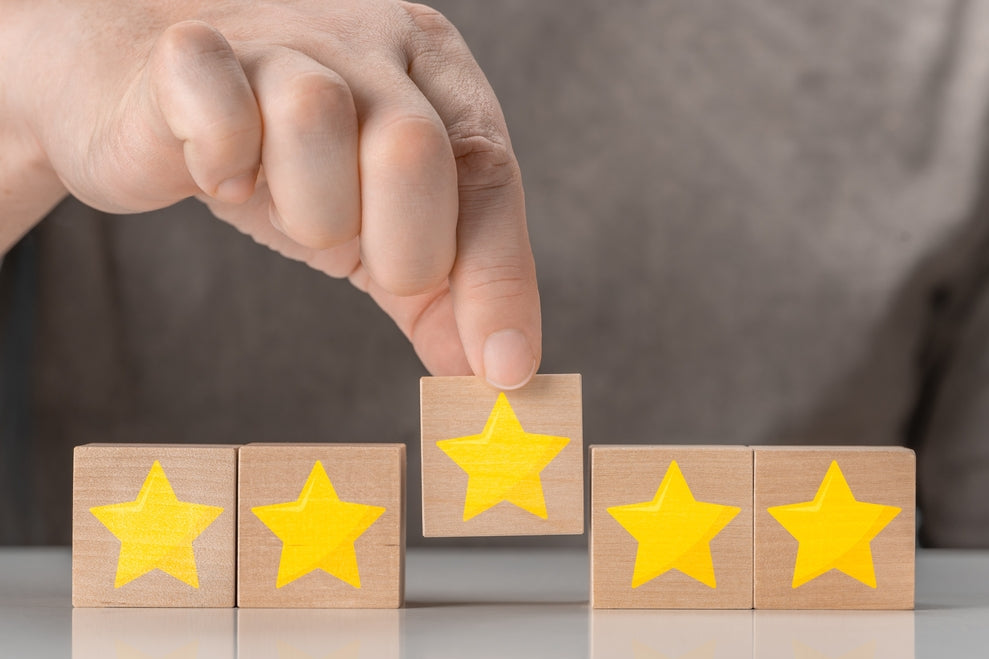 Consistent service quality: a five star rating on wooden blocks