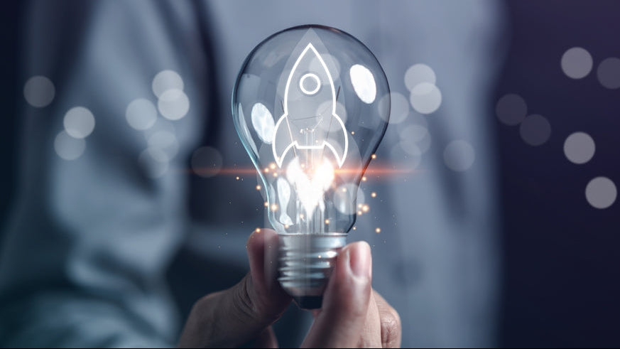 Light bulb containing a rocket, reflecting the company mission