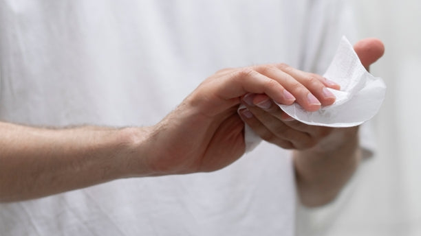 Hand towels: a person drying their hands with a paper towel