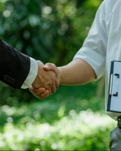 Ethical Purchasing Policy: two colleagues shaking hands