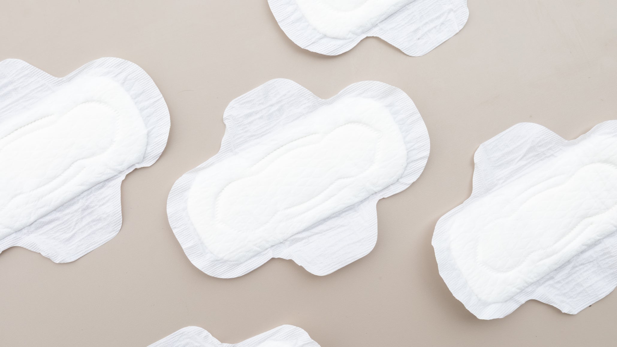 Dual vending: sanitary pads laid out on a neutral surface