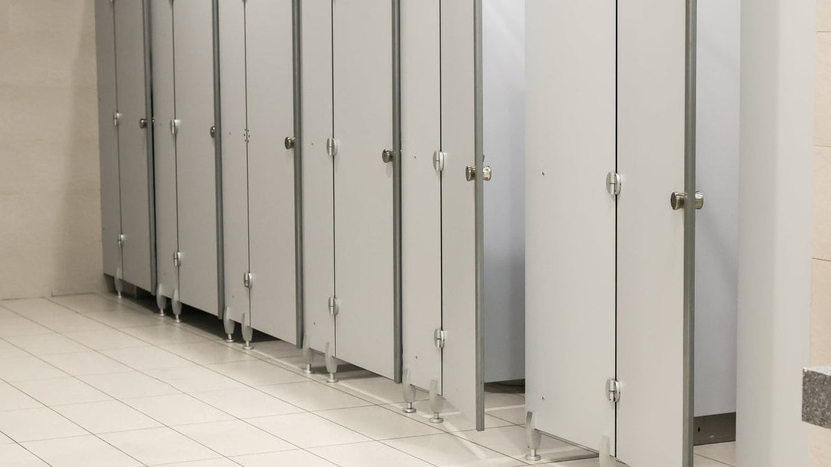 Seat and surface sanitisers: toilets in a public men's washroom