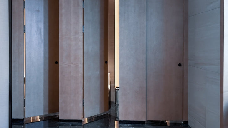 Toilet roll dispensers: a modern men's washroom with urinals and cubicles