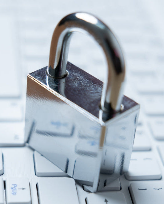 Data Protection Policy: a silver padlock resting on a keyboard