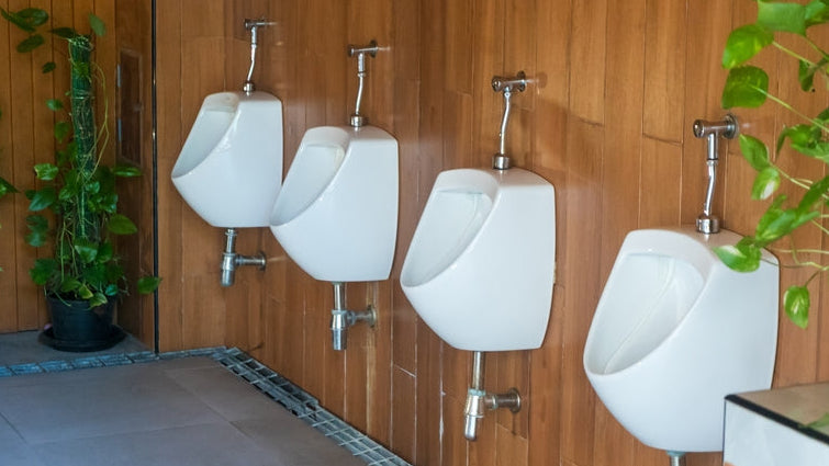 Urinal bio pods: urinals against wooden panelling in a washroom