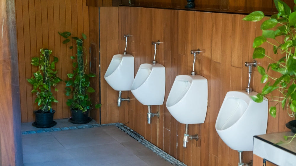 Urinal bio pods: urinals against wooden panelling in a modern washroom