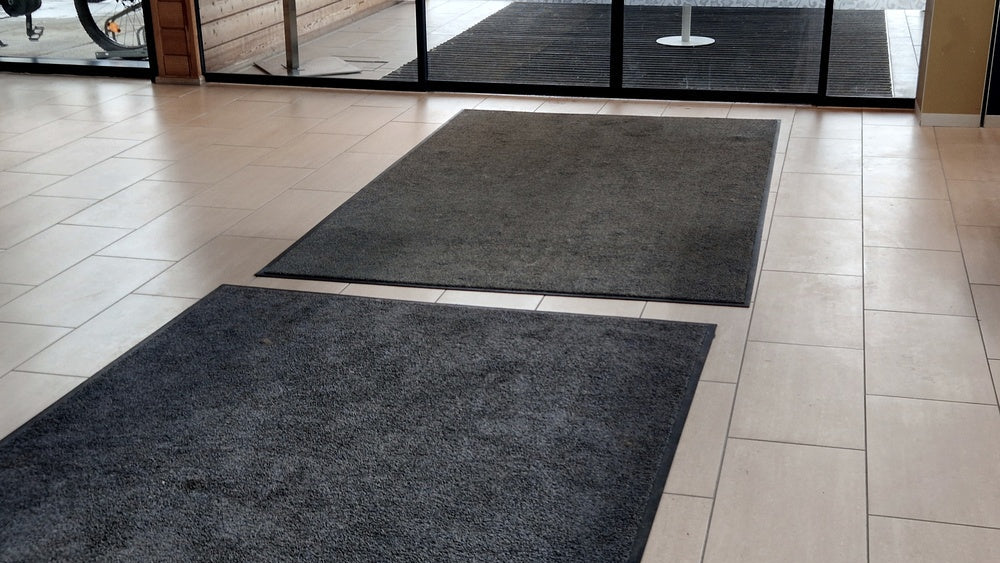 Traffic mats: black textile mats at a high traffic entrance