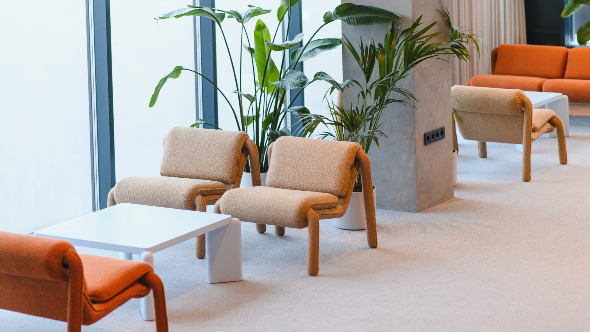 Air purification in a contemporary lounge with beige and orange seating