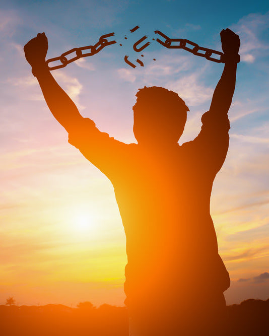 Modern Slavery Policy: a silhouette breaking free of chains