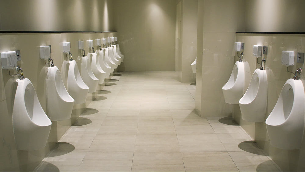 Urinal screens: a row of white urinals in a men's washroom